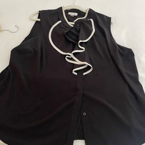 A black sleeveless with ruffles in the front button down blouse by Calvin Klein